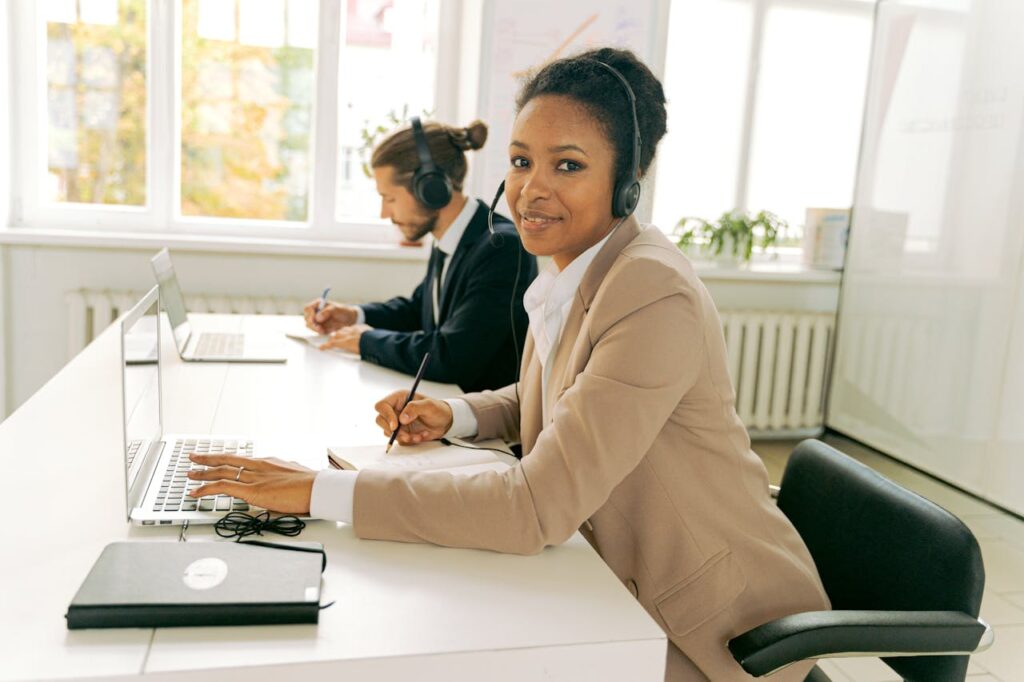 Friendly customer support team working in a bright, modern office.